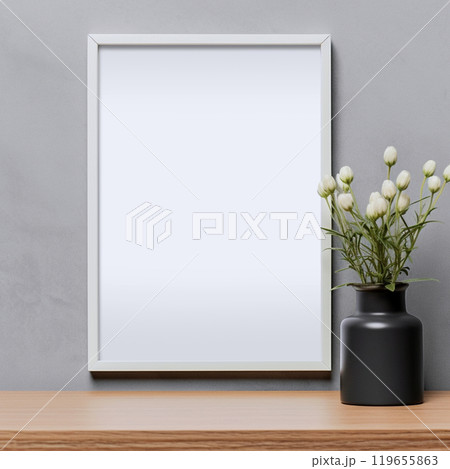 Mockup photo frame on table on light background with vase. Vertical format front view. 119655863