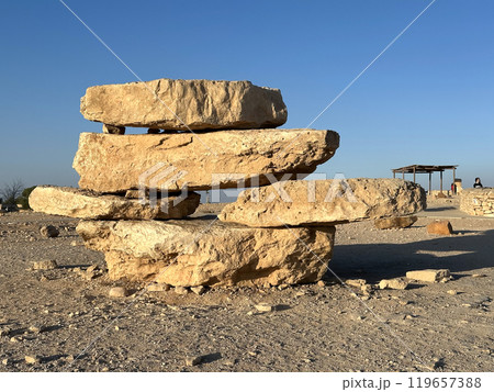 Pyramid of stones on the promenade above the erosion crater Makhtesh Ramon 119657388