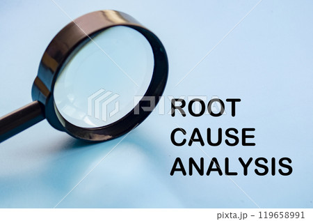 Root Cause Analysis text on blue cover with magnifying glass background. Business solution concept Root Cause Analysis text on blue cover with magnifying glass background. Business solution concept 119658991