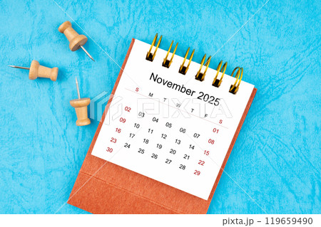 November 2025 mini calendar with wooden thumbtack. November 2025 mini calendar with wooden thumbtack. 119659490