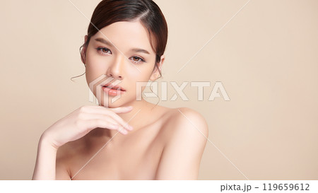 Beautiful young asian woman with clean fresh skin on beige background, Face care, Facial treatment, Cosmetology, beauty and spa, Asian women portrait. 119659612