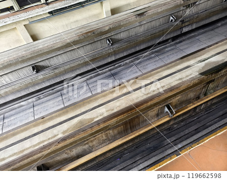 A long metal train tracks at a monorail station 119662598