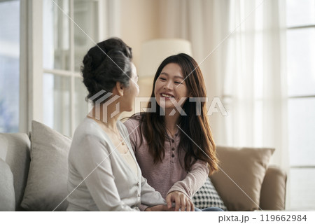 asian adult daughter and senior mother enjoying conversation at home asian adult daughter and senior mother enjoying conversation at home 119662984