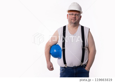 A Construction Worker Posing Proudly while Wearing a Hard Hat and Essential Safety Gear A Construction Worker Posing Proudly while Wearing a Hard Hat and Essential Safety Gear 119663819