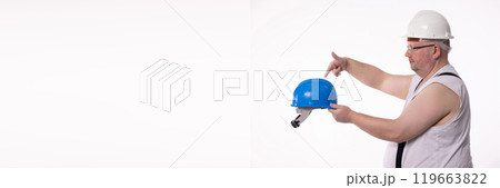 A Construction Worker Illustrating the Vital Importance of Wearing a Safety Helmet for Protection A Construction Worker Illustrating the Vital Importance of Wearing a Safety Helmet for Protection 119663822