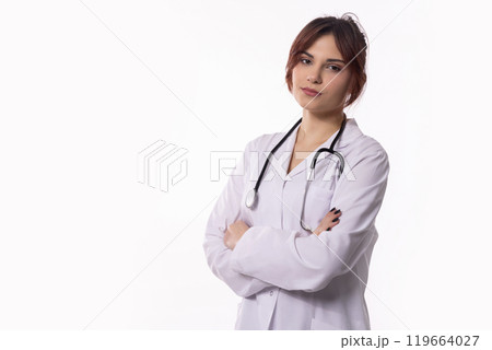 Confident Female Doctor Wearing a White Coat and Holding a Stethoscope, Ready to Help 119664027