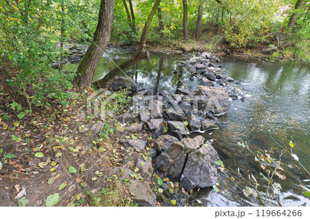 a stone ford across a small river 119664266