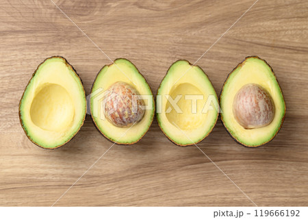 Half Hass avocado fruit ready to eating, Healthy fruit, Table top view Half Hass avocado fruit ready to eating, Healthy fruit, Table top view 119666192