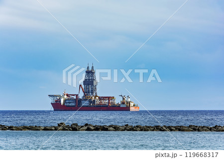 The ship is moored at the oil platform for unloading The ship is moored at the oil platform for unloading 119668317