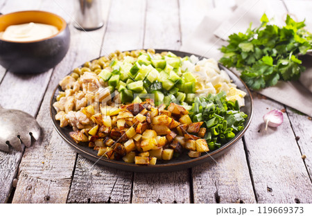 ingredients for salad. chicken, fried potato and vegetables 119669373