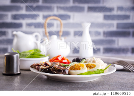 fresh breakfast, boiled eggs with rice meat and vegetables 119669510