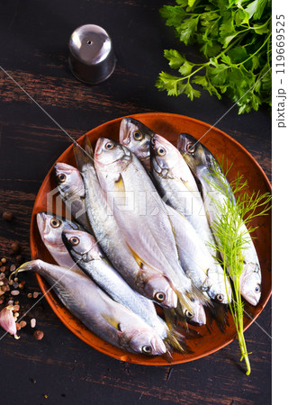 Small fish for cooking, fish on plate Small fish for cooking, fish on plate 119669525
