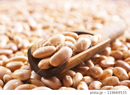 Beans and wooden spoon on a table, copy spase 119669535