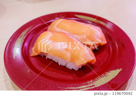 Top view of Japanese fresh salmon sushi with Japanese rice in red plate, focus selective Top view of Japanese fresh salmon sushi with Japanese rice in red plate, focus selective 119670092