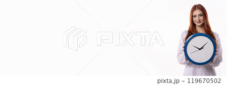 A Smiling Woman Holding a Clock Against a Clean White Background for Visual Appeal A Smiling Woman Holding a Clock Against a Clean White Background for Visual Appeal 119670502