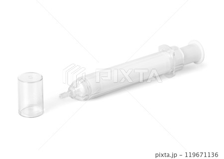 Clear plastic syringe with a removable cap, lying on a white background. Clear plastic syringe with a removable cap, lying on a white background. 119671136