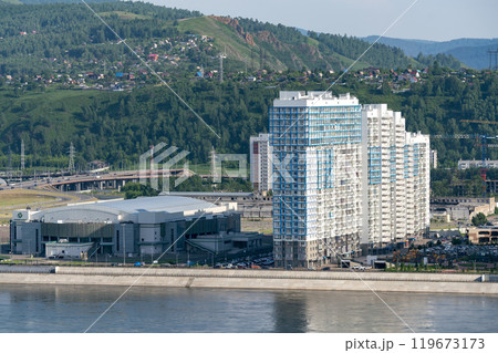 Multi storey building on the river bank. Residential areas of a sleeping area. 119673173