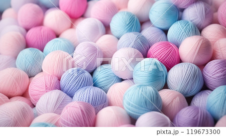 Close-up pattern from lot of colorful round balls of yarn background, collection of rainbow light pastel colors woolen skeins for knitting thread 119673300