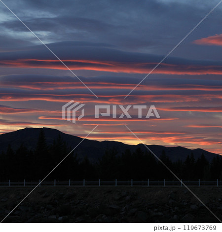Colorful clouds in Hawea, New Zealand. Colorful clouds in Hawea, New Zealand. 119673769