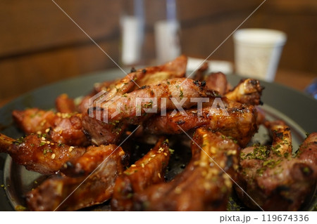 Boiled pork back ribs seasoned and grilled. The meat on the bone is chewy and delicious Boiled pork back ribs seasoned and grilled. The meat on the bone is chewy and delicious 119674336