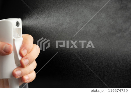 Spray water bottle in hand Spray water bottle in hand 119674729