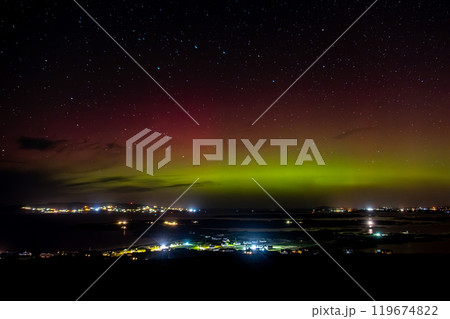 The Aurora Borealis, the northern lights, showing up above Maghery, Burtonport, Arranmore and Dungloe in County Donegal, Ireland. 119674822