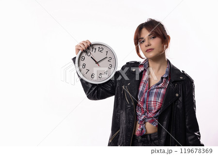 A Fashionable Young Woman Holding a Clock in a Distinctive Modern Style and Flair 119678369