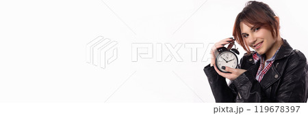 A Young Woman Holding an Alarm Clock, Emphasizing a Modern and Dynamic Lifestyle Concept 119678397