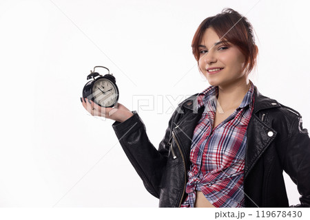 A Stylish Young Woman Holding an Alarm Clock That Represents Her Vibrant Lifestyle A Stylish Young Woman Holding an Alarm Clock That Represents Her Vibrant Lifestyle 119678430