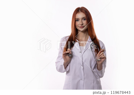 A Young Female Doctor Holding a Stethoscope Standing Proudly in a Modern Medical Laboratory 119678443