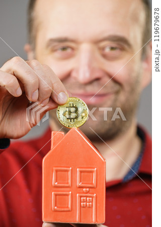 Man paying his house rent using bitcoin 119679678
