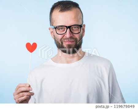 Adult man with heart on stick 119679849