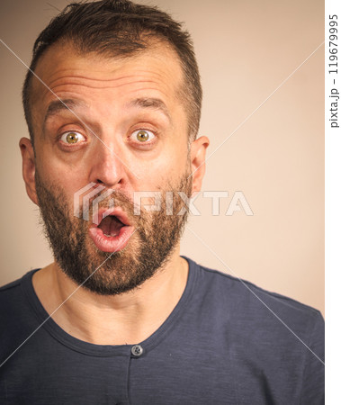 Astonished shocked adult man 119679995