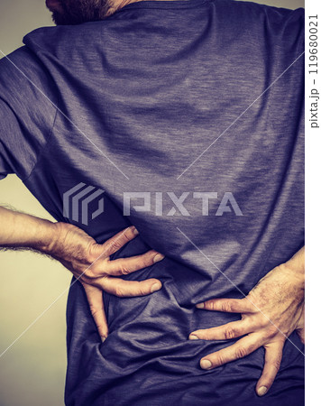 Man having back loins pain ache 119680021