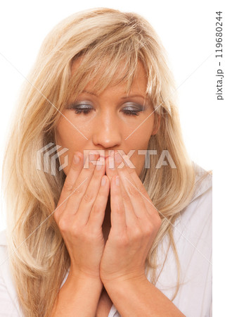 Woman covering her mouth with hands 119680244