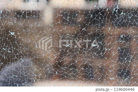 Cracked clear glass full frame. Close up 119680446