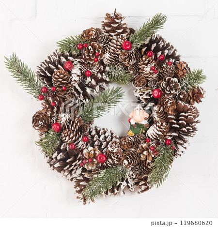 Elegant christmas wreath decorated pine cones and fir trees. Christmas mood. 119680620