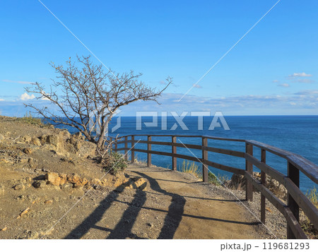 Wooden fence on the edge of the cliff. Wooden fence on the edge of the cliff. 119681293