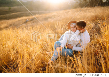 Young couple having fun walking and hugging n the park. Autumn weather. Relaxation, youth. 119681504