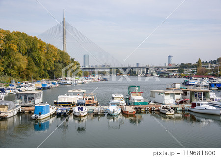 Boat marina at Ada Ciganlija with Ada Bridge, a cable-stayed bridge over the Sava river in Belgrade, Serbia 119681800