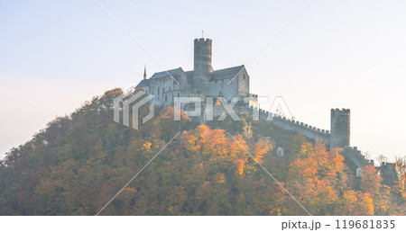 Autumn transforms Bezdez Castle into a vibrant sight, where the Gothic architecture stands proudly amidst the colorful trees, reflecting the rich history of the Czech lands. Autumn transforms Bezdez Castle into a vibrant sight, where the Gothic architecture stands proudly amidst the colorful trees, reflecting the rich history of the Czech lands. 119681835