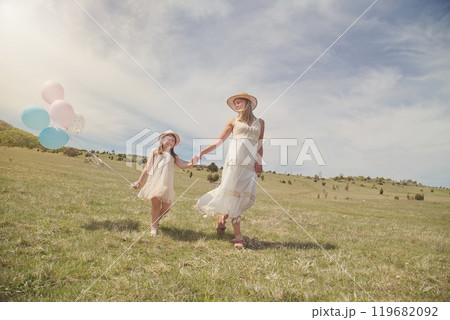 Young mother and her daughter having fun in nature park Young mother and her daughter having fun in nature park 119682092