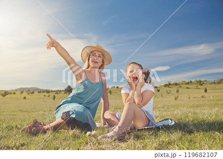 Young mother and her daughter having fun in nature park Young mother and her daughter having fun in nature park 119682107