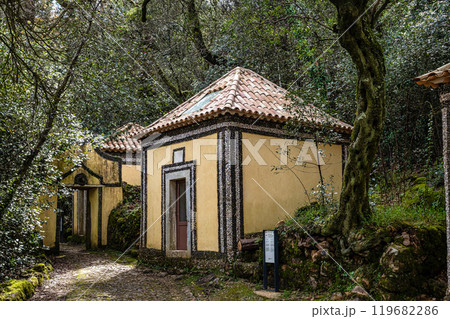 Calvary chapel in the way to the cross, via crucis, trail on ancient forest of Bussaco, in Luso, Aveiro in Portugal. Calvary chapel in the way to the cross, via crucis, trail on ancient forest of Bussaco, in Luso, Aveiro in Portugal. 119682286