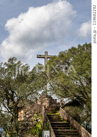 Ancient oak forest of Bussaco, in Luso, Aveiro in Portugal. Trail between trees. Stairs in forest. Forest footpath. 119682292