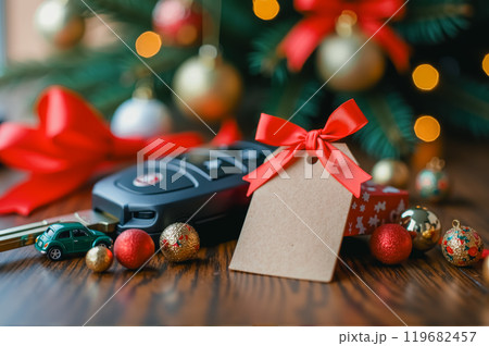 Car key with holiday gift and festive ornaments. AI generation 119682457