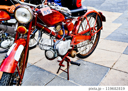 Classic red motorcycle in the city of Igualada Classic red motorcycle in the city of Igualada 119682819