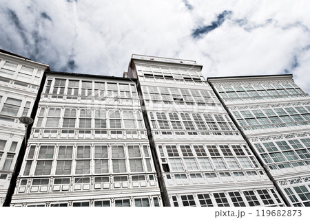 Low angle of white facades with glass balconies on Avenida de Marina, A Coruna, Galicia 119682873