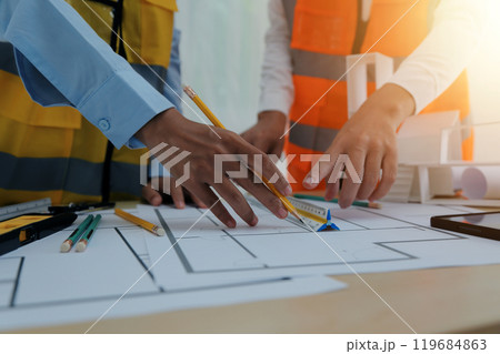 Construction and structure concept of Engineer or architect meeting for project working with partner and engineering tools on model building and blueprint in working site, contract for both companies. 119684863
