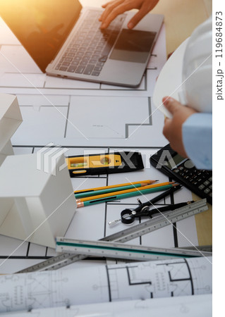 Construction and structure concept of Engineer or architect meeting for project working with partner and engineering tools on model building and blueprint in working site, contract for both companies. Construction and structure concept of Engineer or architect meeting for project working with partner and engineering tools on model building and blueprint in working site, contract for both companies. 119684873